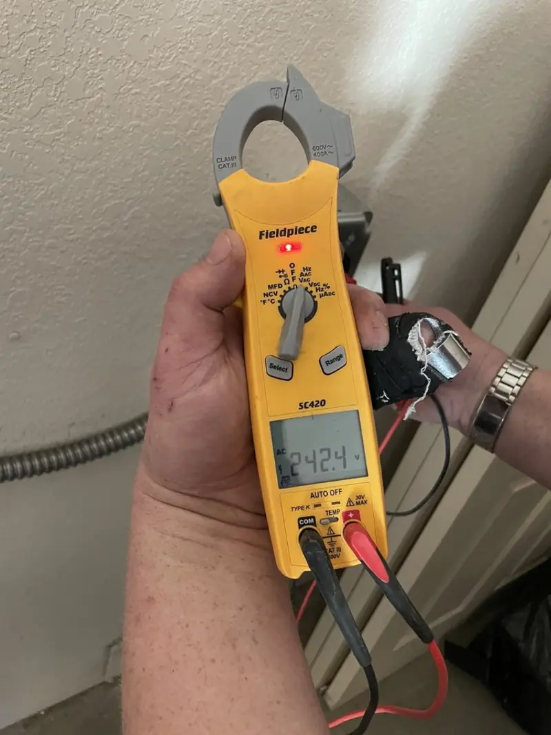 Voltage testing with clamp meter during Whole House Surge Protector in Jacksonville